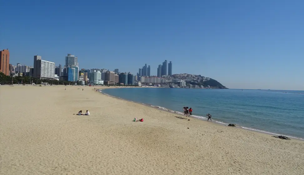Haeundae Beach with few people laying on the beach