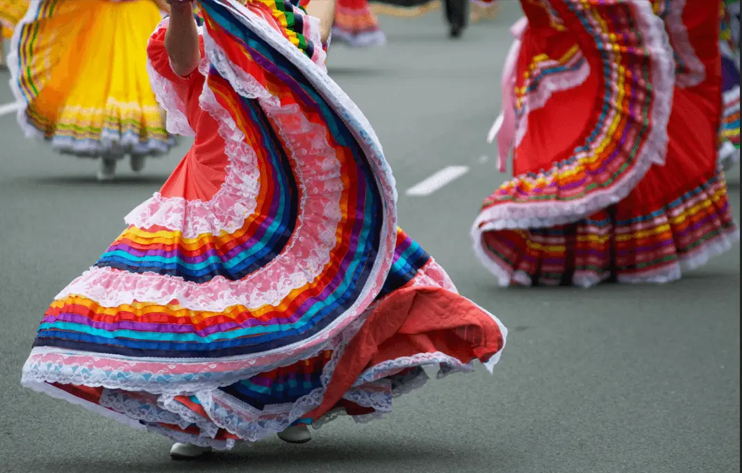 colorful skirts of women dancing during cinco de mayo