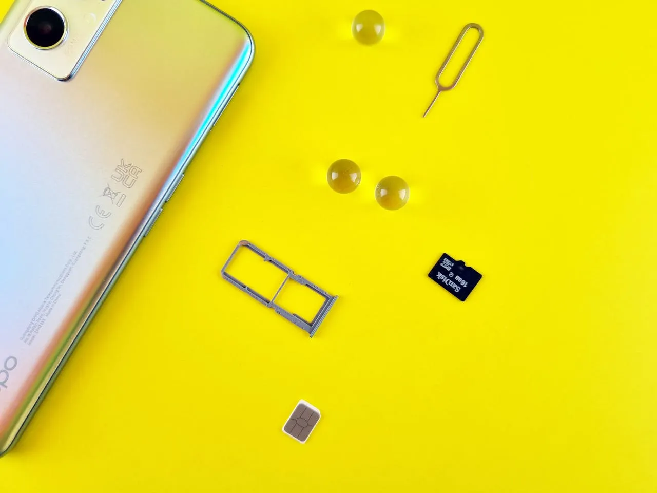 eSIM and SD card laying next to phone