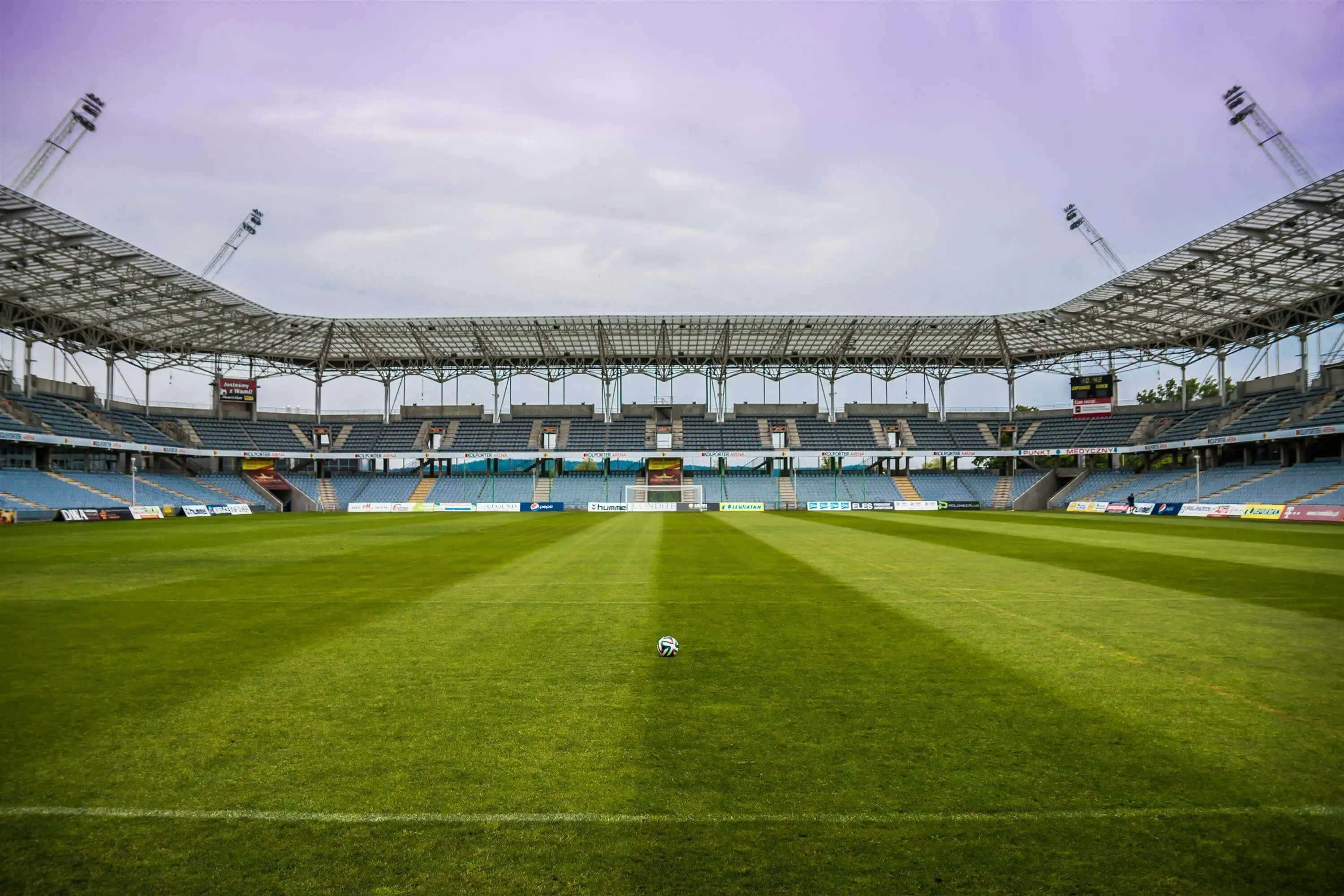 Soccerball on Wide Green Grass Field