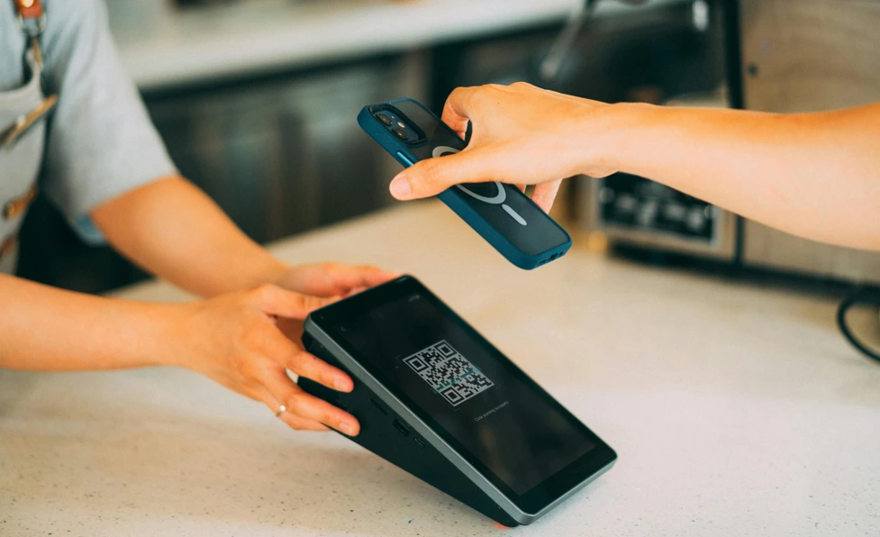 mobile phone payment at a shop via a QR code