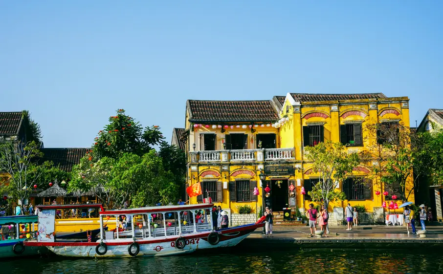 Yellow old houses in Hoi An during sunny day
